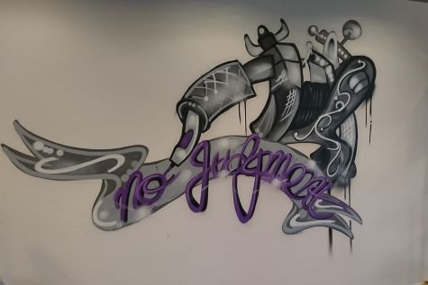 Een Foto van een tatoe kunst werk gemaakt met graffiti